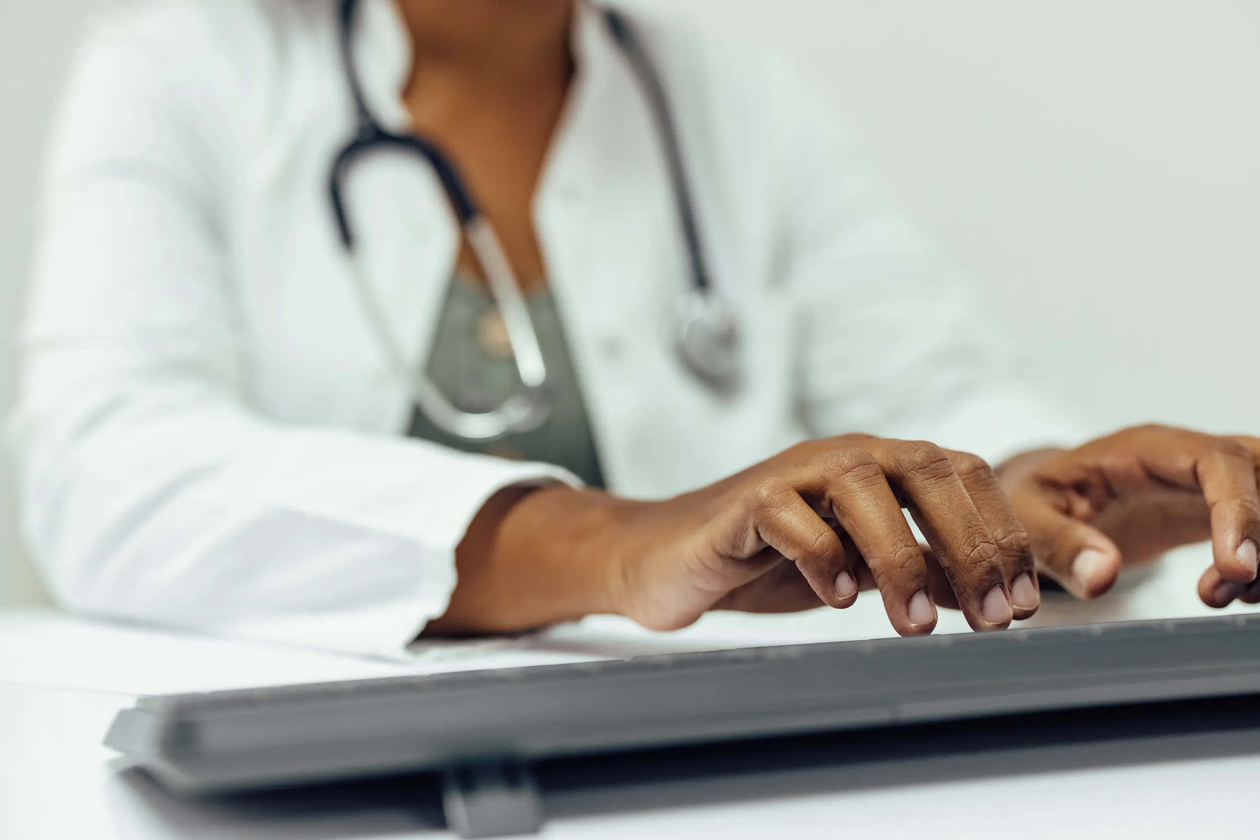 close up of doctor working on computer typing on 2026 01 05 05 47 19 utc