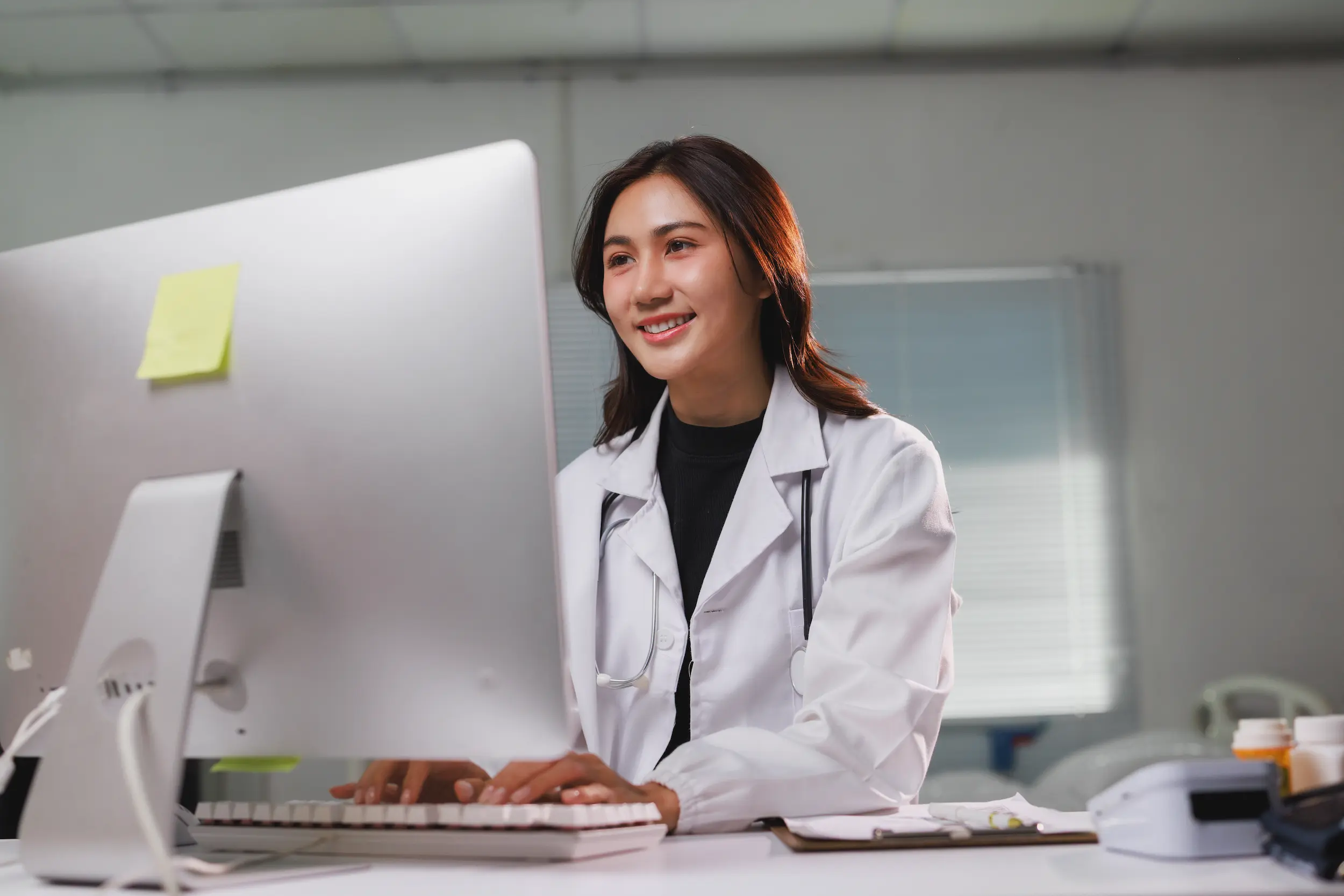 female doctor working on computer in medical offic 2026 03 27 00 47 09 utc